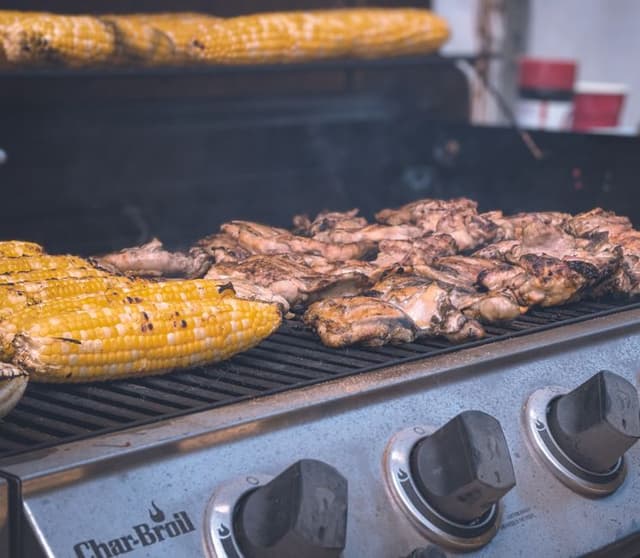Three burner gas grill, new grates, rusty cart legs