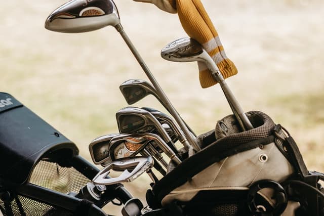Full set of irons, woods, putter and stand bag